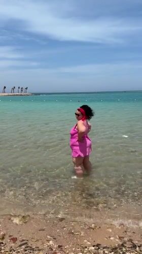 Woman enjoys morning beach time in Hurghada, Egypt