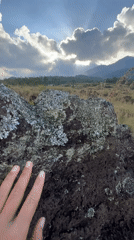 Tourists explore misty Kintamani highlands on motorcycles and foot
