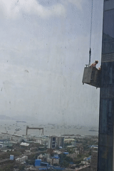 High-rise window cleaning underway on Mumbai's waterfront skyline