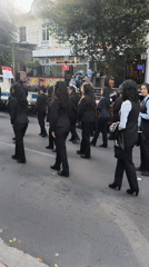 Formal musical procession with marching band takes place in La Paz