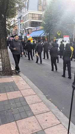 Formal musical procession with marching band takes place in La Paz