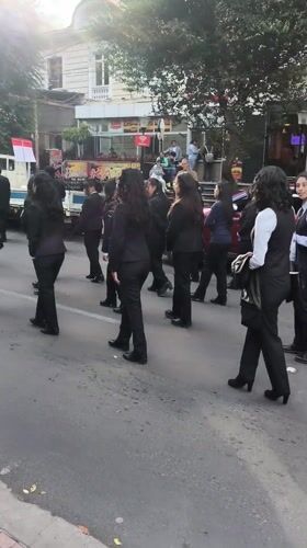 Formal musical procession with marching band takes place in La Paz