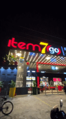 Item7go restaurant exterior documented at night in Ilado, Nigeria