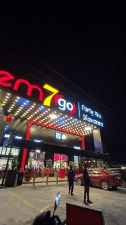 Item7go restaurant exterior documented at night in Ilado, Nigeria