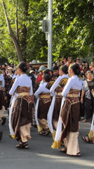 Traditional Balinese procession with musicians and ceremonial floats in Denpasar