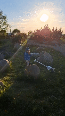 Child plays outdoors on spring afternoon in Rappolovo