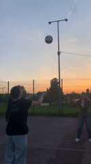 Women play volleyball at sunset in Foki, Russia
