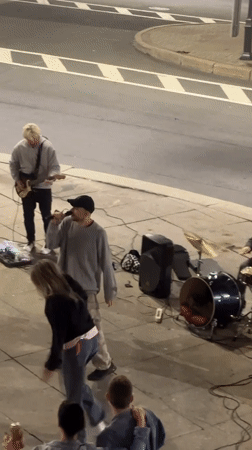 Live street performance draws dancing crowd in St. Petersburg night square