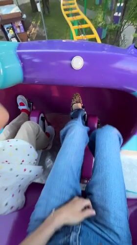 Amusement park visitors document rides and attractions in Khimki