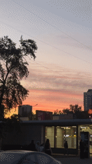 Moscow evening scenes: sunset cityscape, unicyclist crosses street