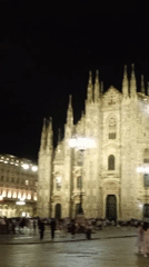 Night activity around an illuminated Duomo di Milano