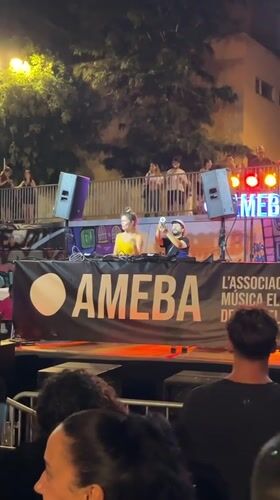 Outdoor DJ set draws a crowd in Barcelona at night