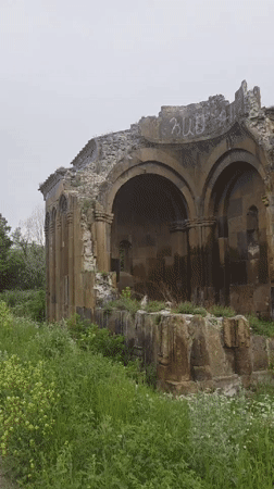Visitor documents medieval Armenian monastery and surrounding village life