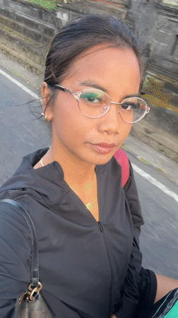 Woman records selfie video while walking in Sibanggede