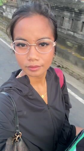 Woman records selfie video while walking in Sibanggede