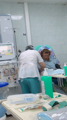 Hospital dialysis treatment and rain-soaked spring foliage documented in Chaikovsky