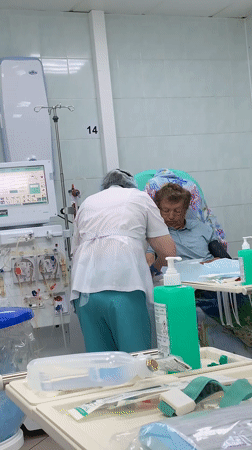 Hospital dialysis treatment and rain-soaked spring foliage documented in Chaikovsky