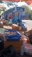 Ground-level scenes at Surabaya's Bungurasih bus terminal