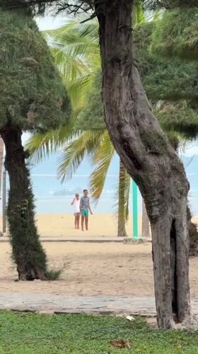 Nha Trang beach and shoreside park on a quiet overcast morning
