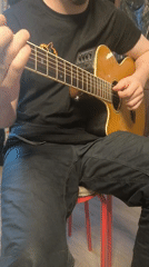 Street musician performs on guitar in Bobrovo, Russia