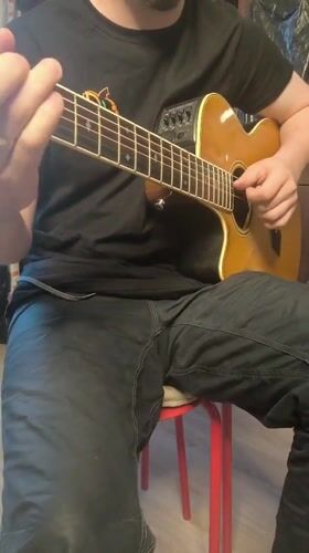 Street musician performs on guitar in Bobrovo, Russia