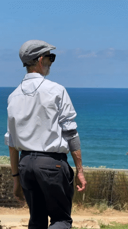 Tel Aviv beachfront morning: surfers, dog walkers, and sea views