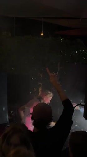 Live DJ set and stage performance at a Moscow nightclub