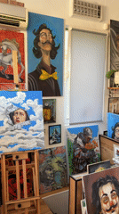 Art studio visitor documents paintings in Plovdiv gallery