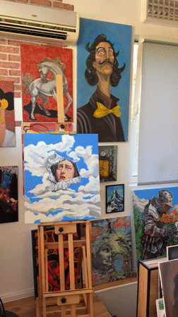 Art studio visitor documents paintings in Plovdiv gallery