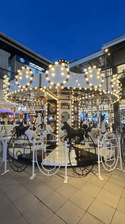 Evening carousel operates in Baan Chaweng plaza