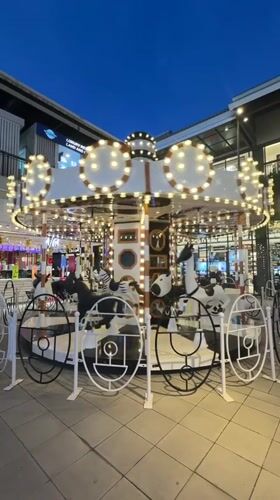 Evening carousel operates in Baan Chaweng plaza
