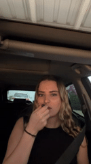 Woman takes selfies, applies makeup in car near Puebla