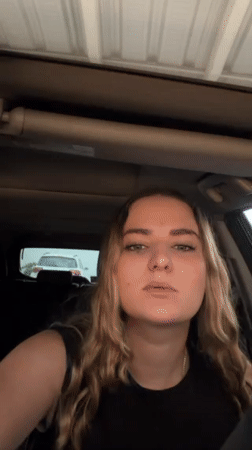 Woman takes selfies, applies makeup in car near Puebla