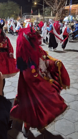 Night parade in Pozo Almonte features devil costumes and live drumming