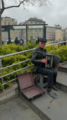 Street musician performs near Galata Tower in Beyoğlu