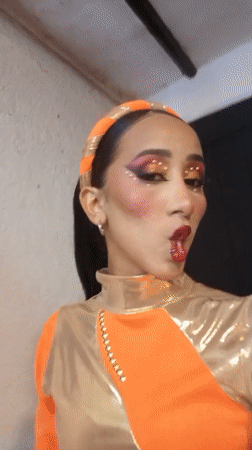 Costumed performers capture selfies during late-night Venezuela event