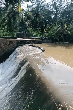Water flows over concrete dam in Keudekrueng, Indonesia