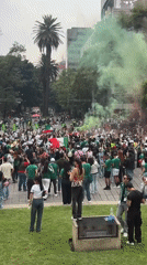 Crowds gather at Mexico City's Angel monument with flags