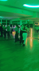 Couples dance in colorful mirrored hall in Kyiv