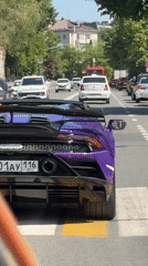Purple Lamborghini spotted driving through Kazan intersections, parked on crosswalk