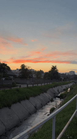 Evening walk along Mahilyow's canal roads at sunset