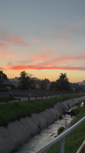 Evening walk along Mahilyow's canal roads at sunset