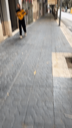 Summer evening street life and storefronts in Tarragona