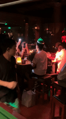 Birthday celebration observed at Liangjiang bar during afternoon