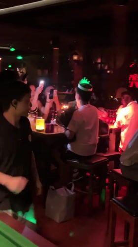 Birthday celebration observed at Liangjiang bar during afternoon