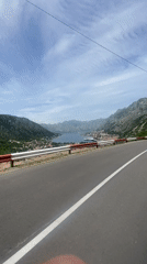 Cruise ship spotted in Kotor Bay from coastal road