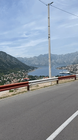 Cruise ship spotted in Kotor Bay from coastal road