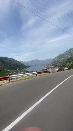 Cruise ship spotted in Kotor Bay from coastal road