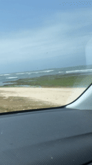 Vehicle passenger films coastal view in Moulay Abdallah, Morocco