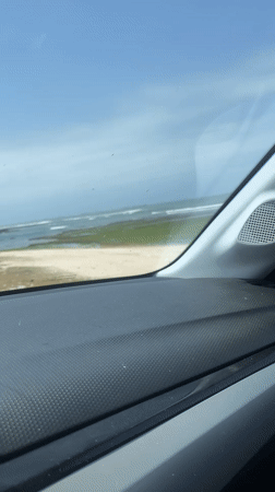 Vehicle passenger films coastal view in Moulay Abdallah, Morocco